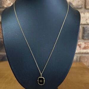 Vintage gold tone starburst and black enamel pendant on dainty chain